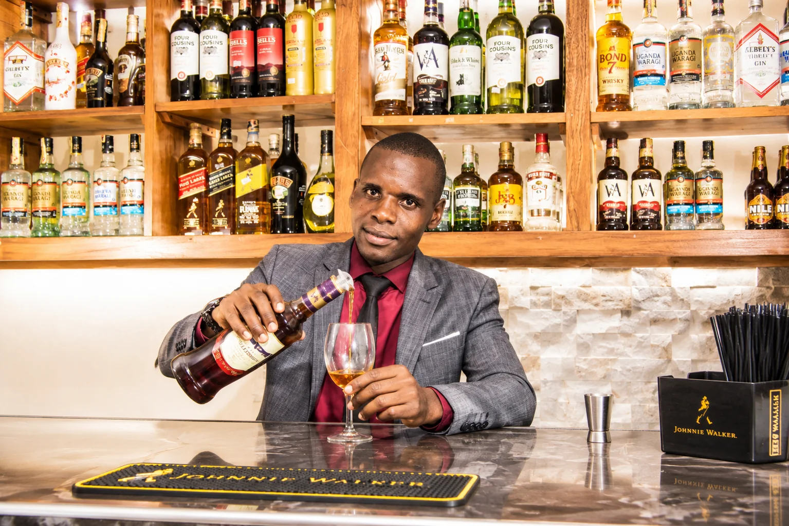 Bartender presenting a bottle
