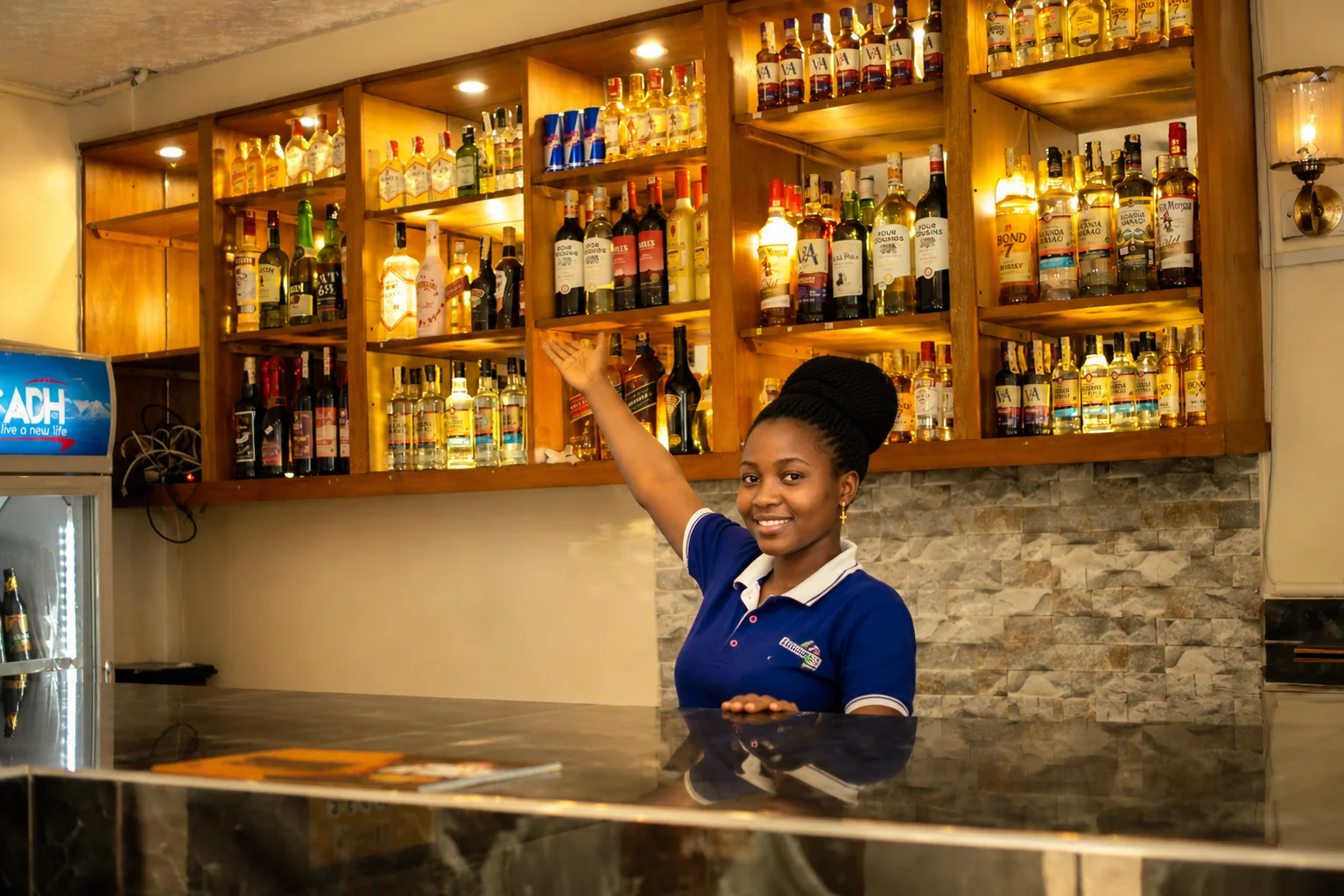 Bar attendant behind the counter